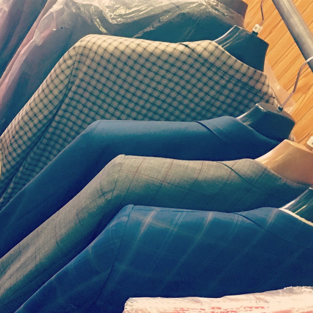 Tailored jackets hanging on a rack